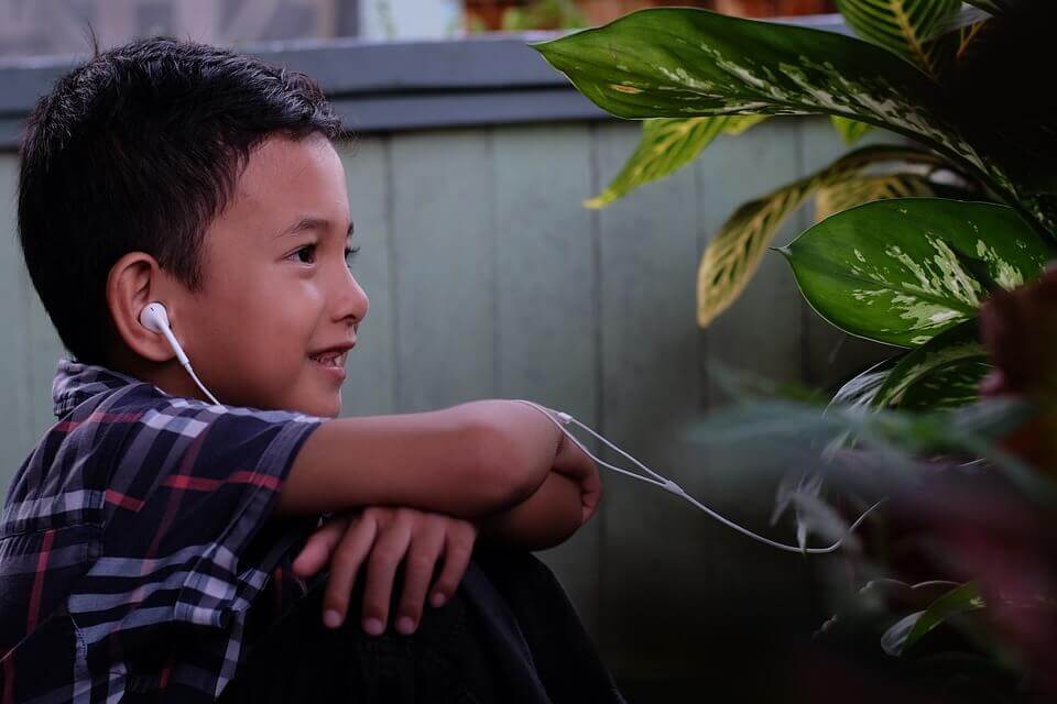 Kid engaged with a plant