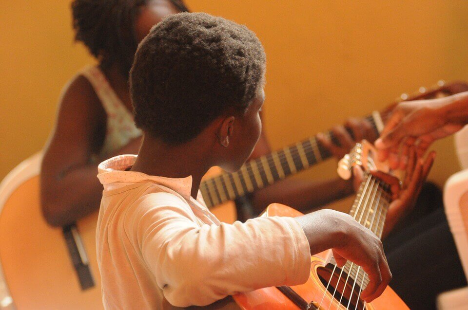 Child playing guitar
