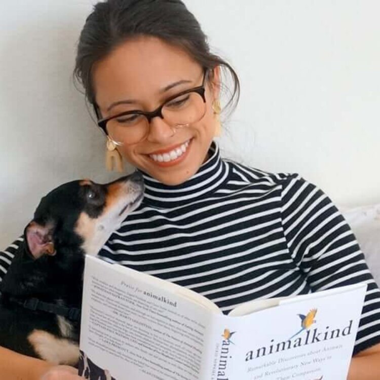 Woman reading 'Animalkind' book