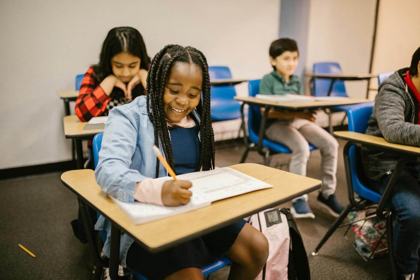 Children sitting at desks in a classroom
