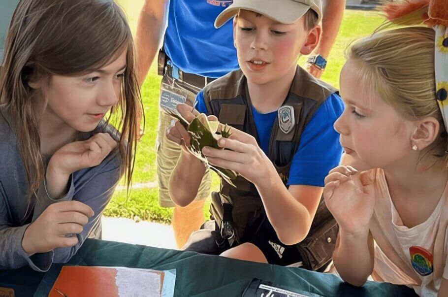Photo of children looking at a KindFrog