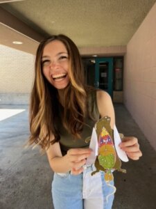 Student with a paper animal model