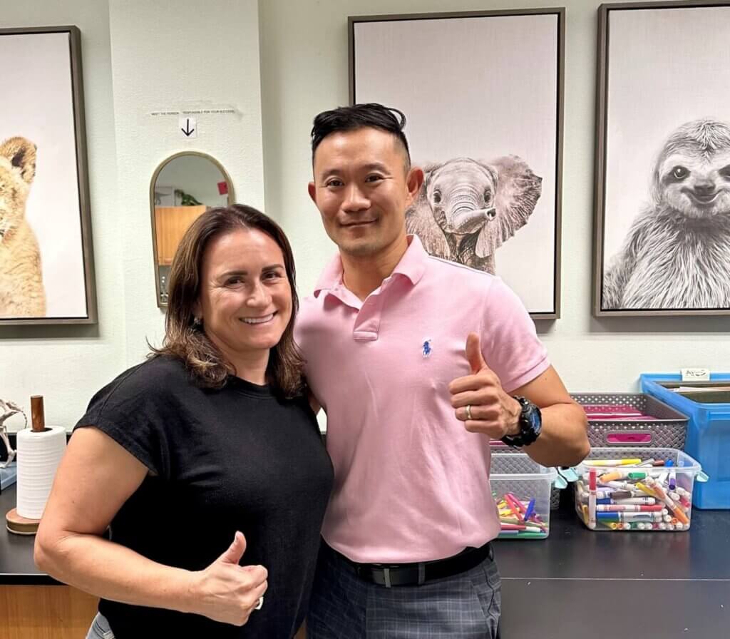 Two teachers smiling