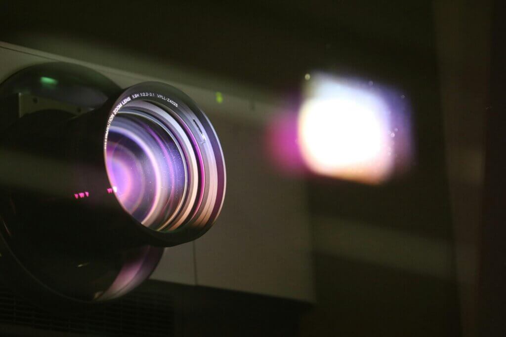 A Black Projector Lens Reflecting Light