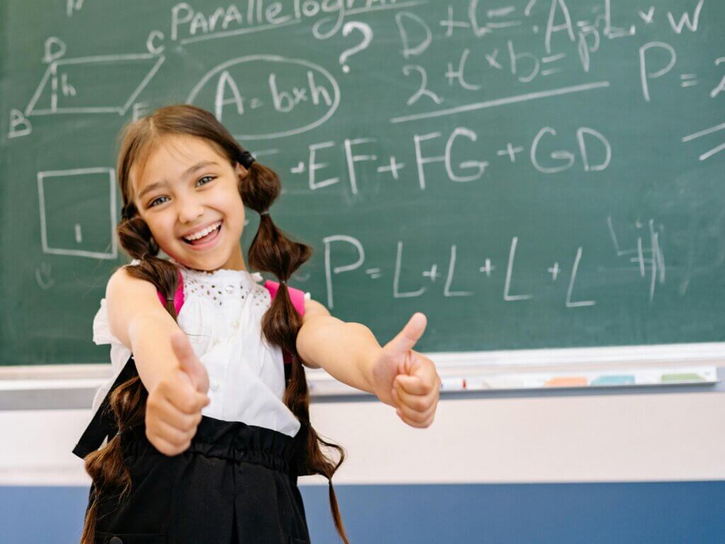 student giving two thumbs up