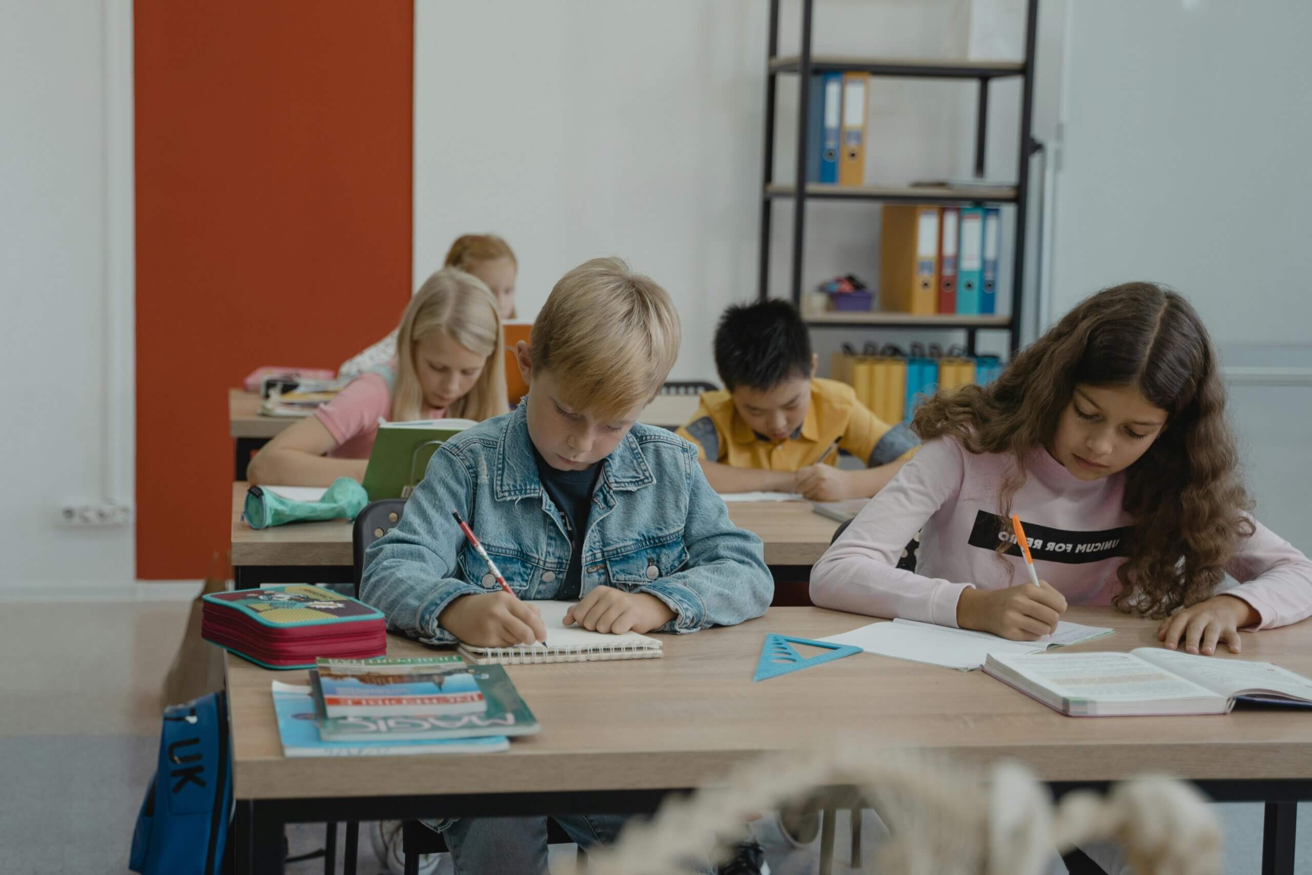 students writing at their desk