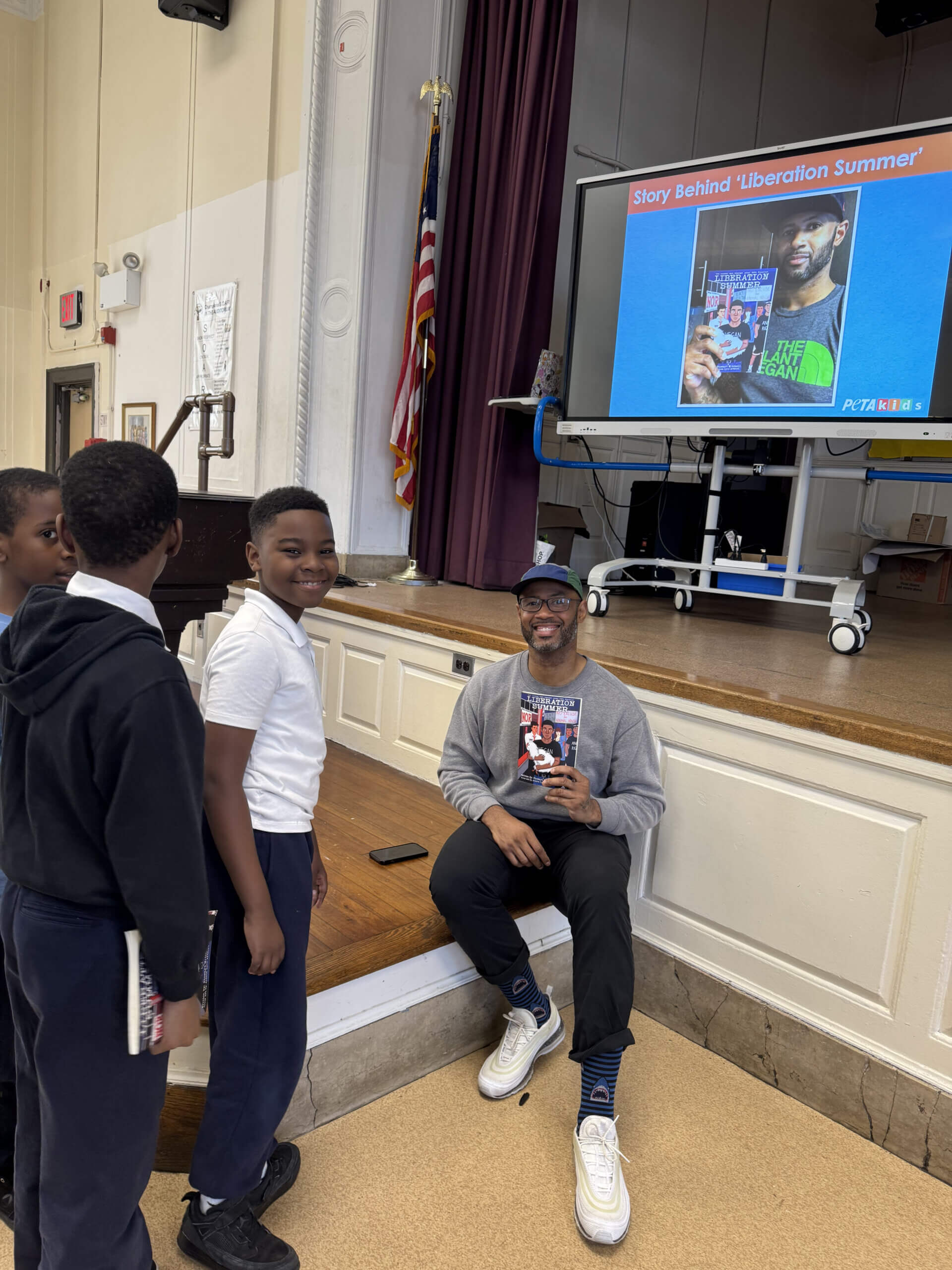Stewart Mitchell is signing students' copies of Liberation Summer at the Meet the Author event in NYC at PS37Q