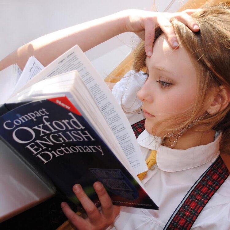 Girl reading dictionary