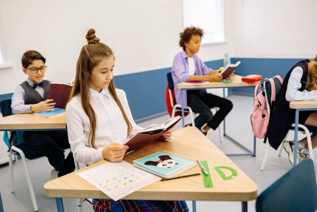 Middle school students reading books